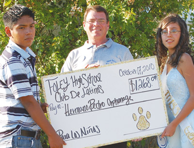 Foley Kids Present Check for Hermano Pedro Orphanage